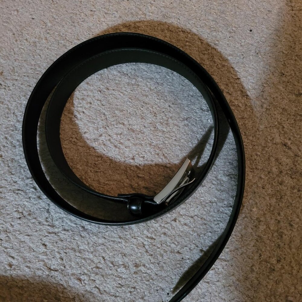 NWOT black leather belt, fits size XL and XXL (42-46) with silver buckle